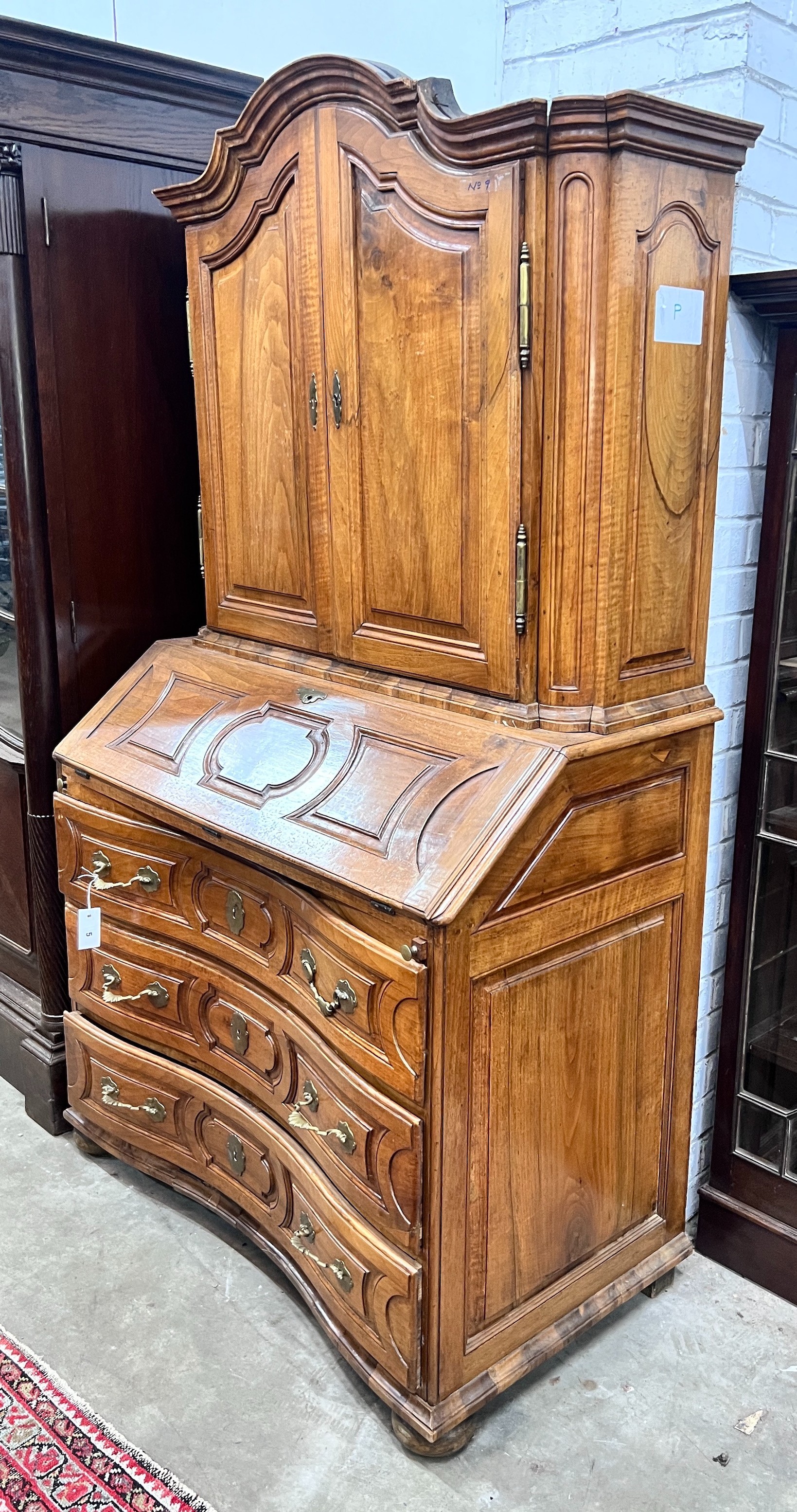 A 19th century German walnut bureau cabinet, width 105cm, depth 57cm, height 188cm, *Please note the sale commences at 9am.